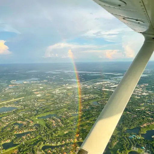 Rainbow seen from the window of a flying airplane