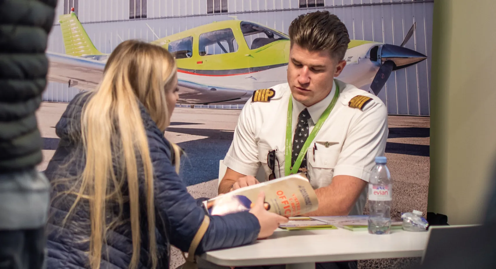 Flight instructor and adult student reviewing a lesson together