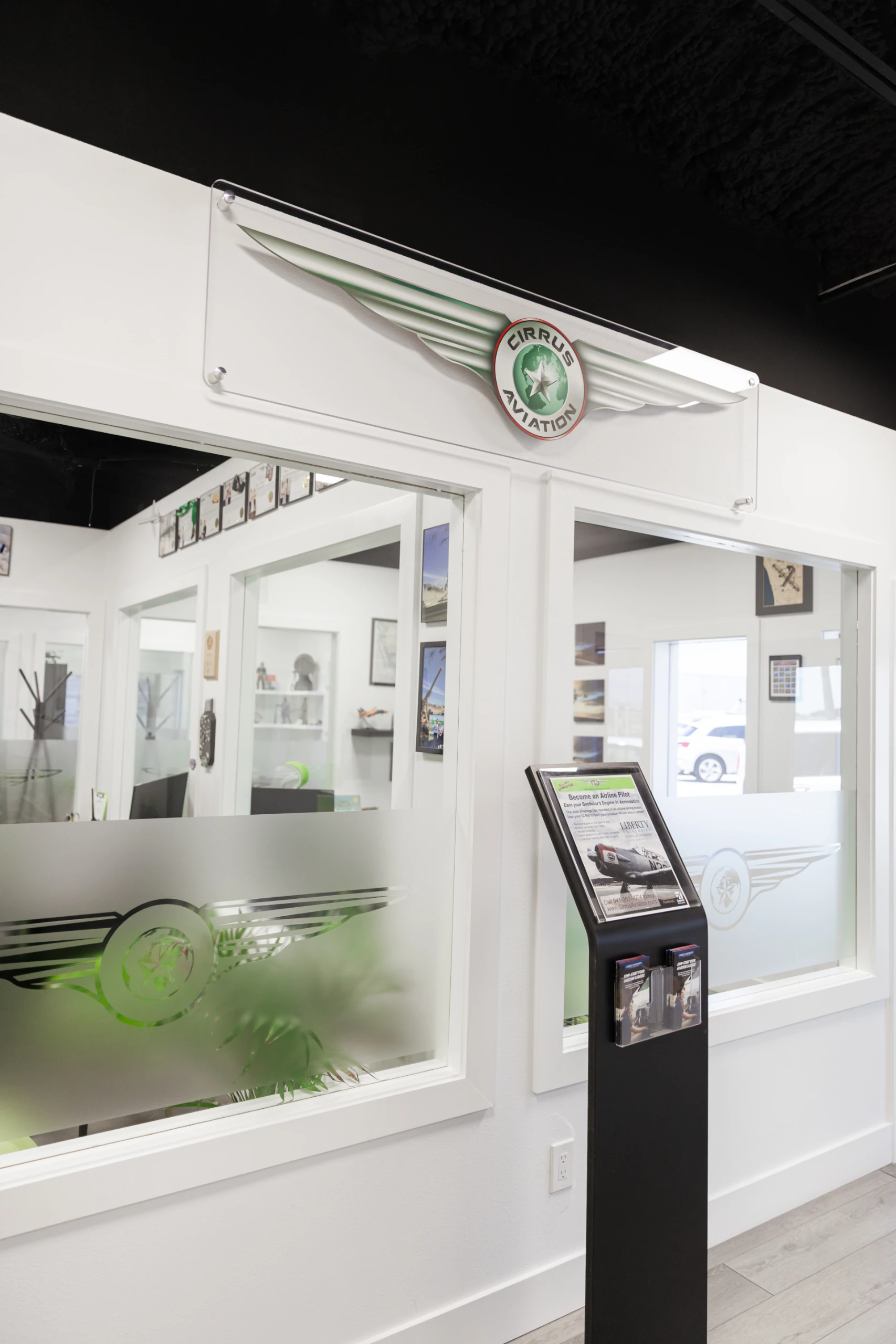 Cirrus Aviation's office and a plaque with their logo on it