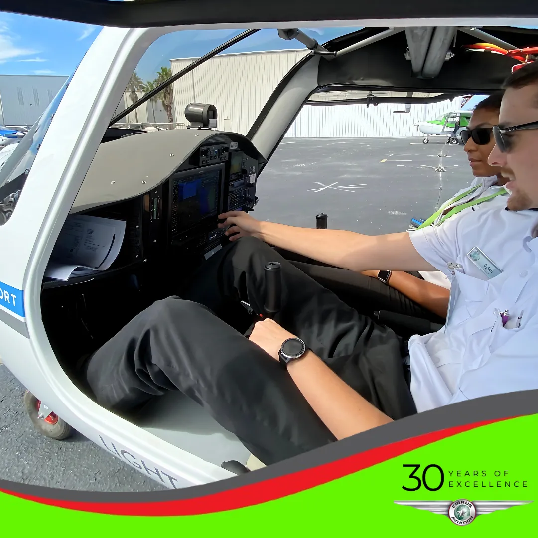 Instructor and student in the open cockpit of a Pipistrel Alpha Trainer with a Garmin G3X panel
